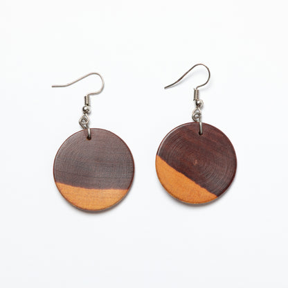 Wooden earrings with two-tone design on a white background