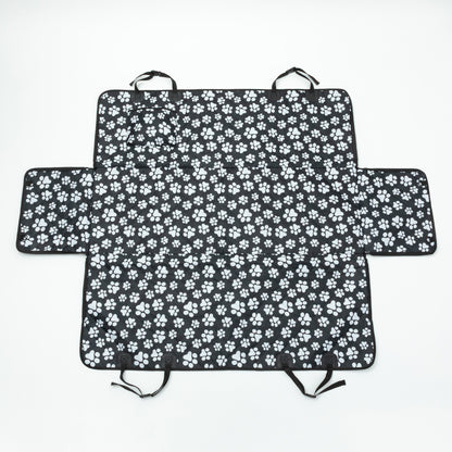 Black car seat cover with white paw prints on a white background