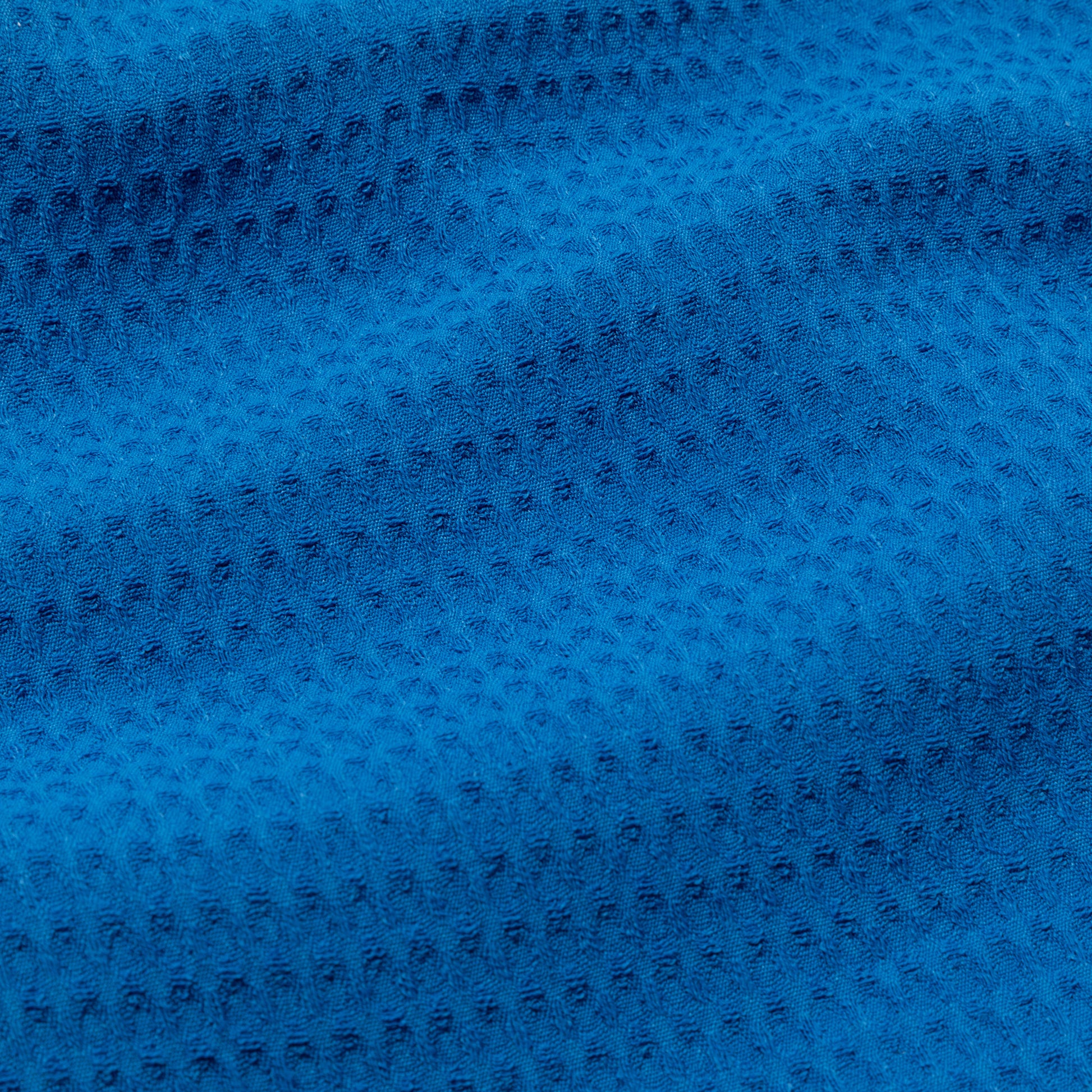 Close-up of blue waffle weave textured fabric