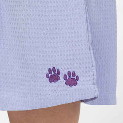 Light purple waffle weave shorts with embroidered paw prints on a white background