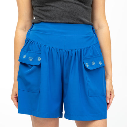 Blue shorts with paw prints on a white background