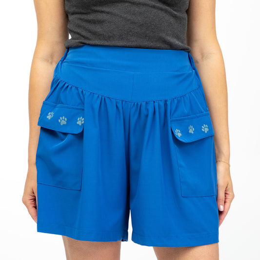 Blue shorts with paw prints on a white background