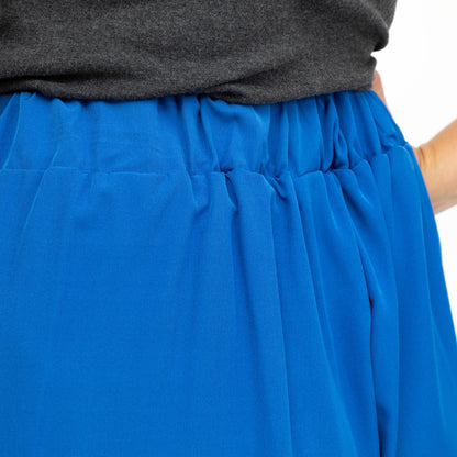 Blue shorts with a gray top on a white background