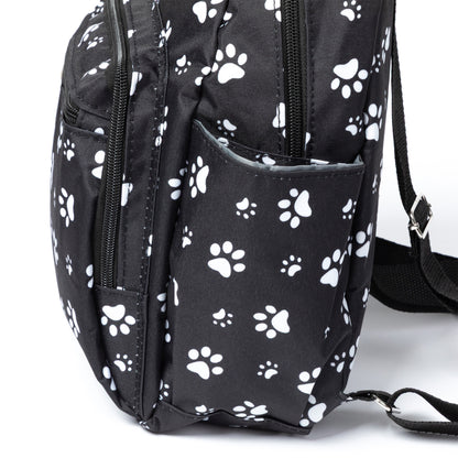 Black backpack with white paw prints on a white background
