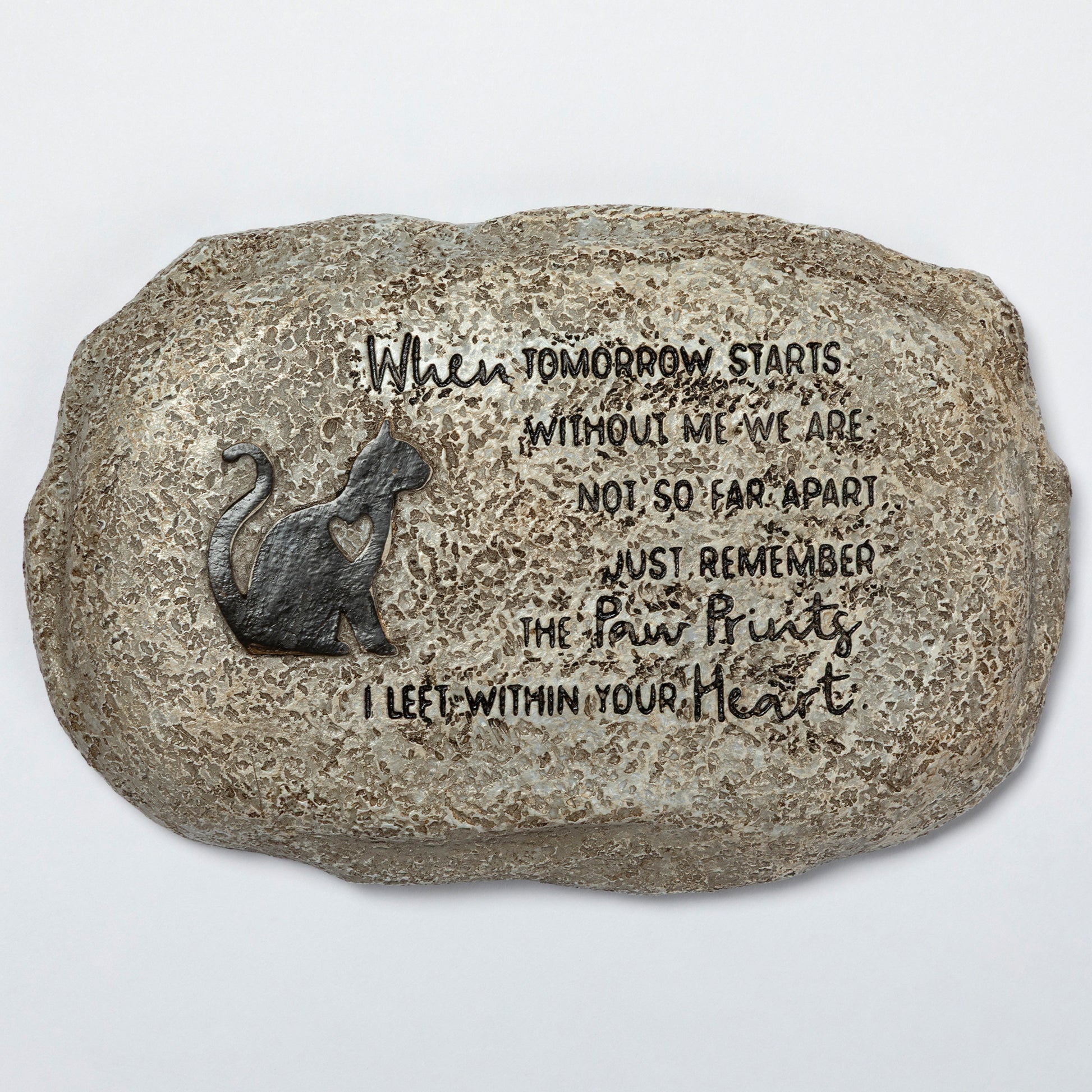 Decorative stone with a cat silhouette and engraved text on a white background