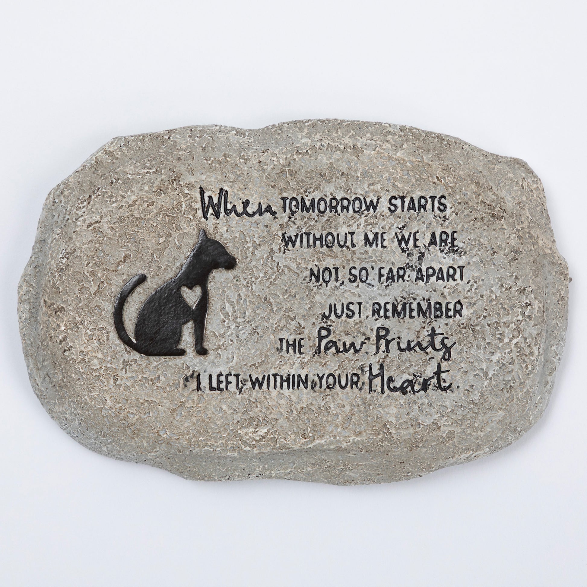 Decorative stone with a dog silhouette and engraved text on a white background
