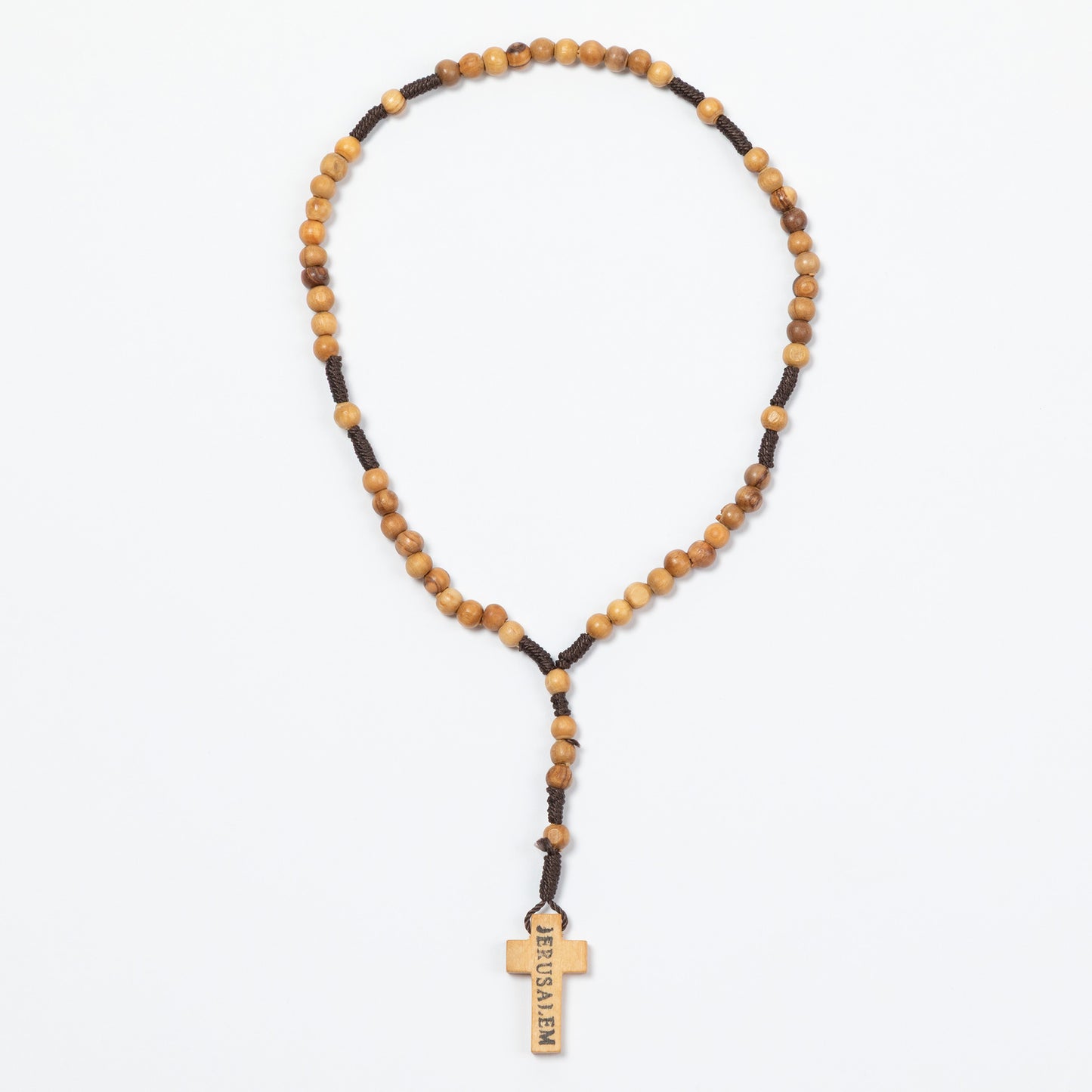 Necklace with wooden beads and a cross pendant on a white background