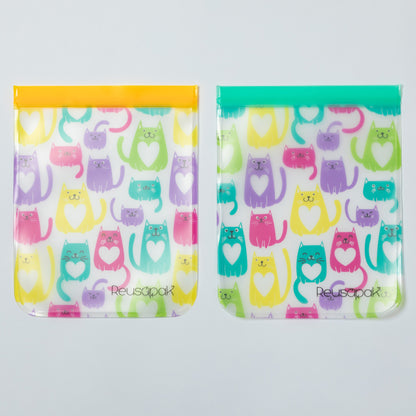 Two reusable snack bags with colorful cat pattern on a gray background