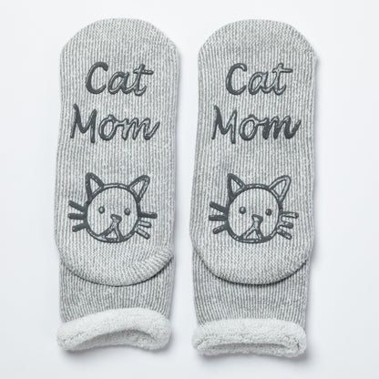 Gray socks with 'Cat Mom' text and cat illustrations on a white background
