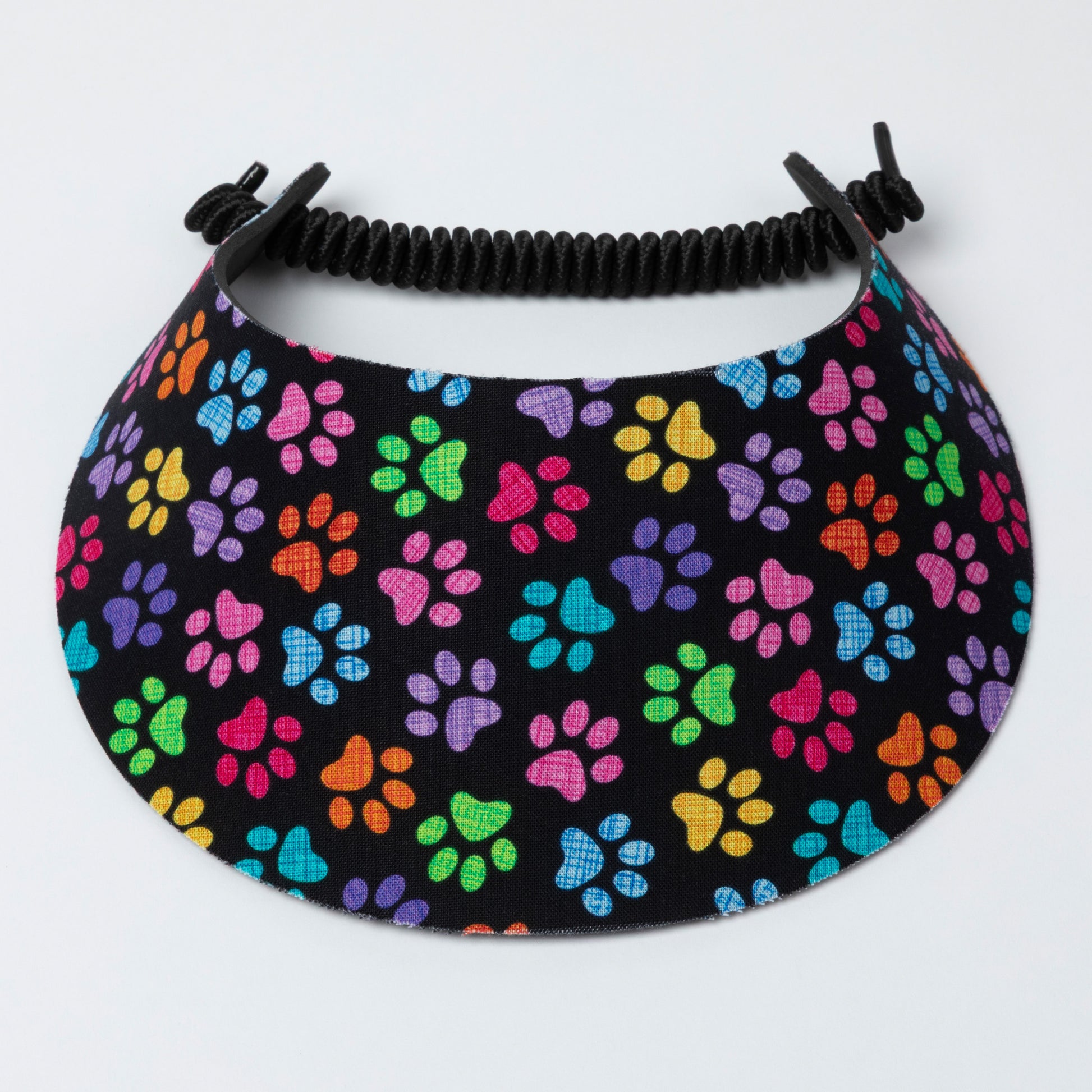 Visor with colorful paw pattern on a black background