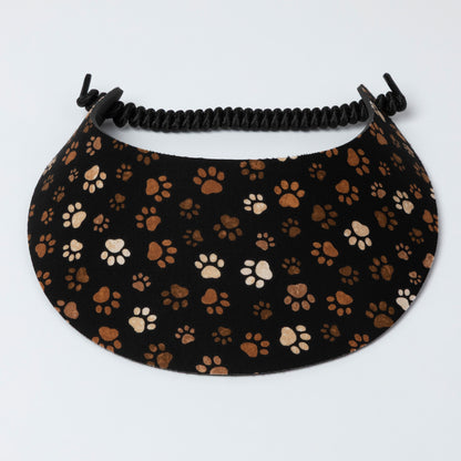Visor with paw print pattern on a black background