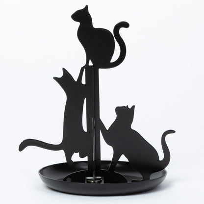 Black metal cat-shaped jewelry holder with three cat silhouettes on a round base, photographed against a plain white background.