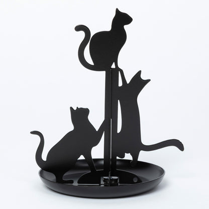 Black metal cat silhouette stand with three cat cutouts on a round base, photographed against a plain white studio background.