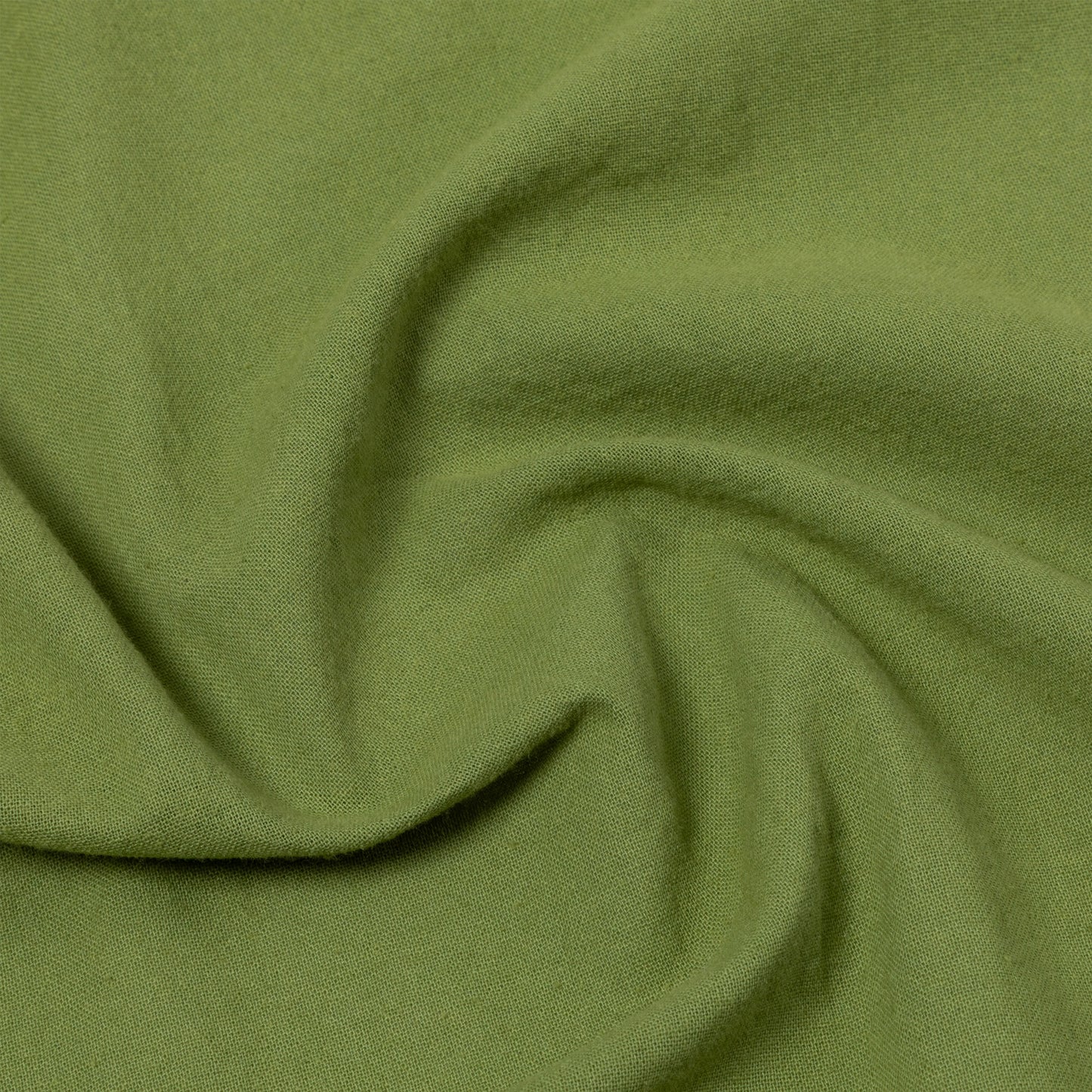 Close-up of green dish towel with folds