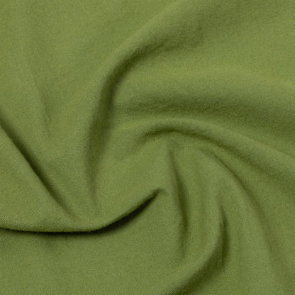 Close-up of green dish towel with folds