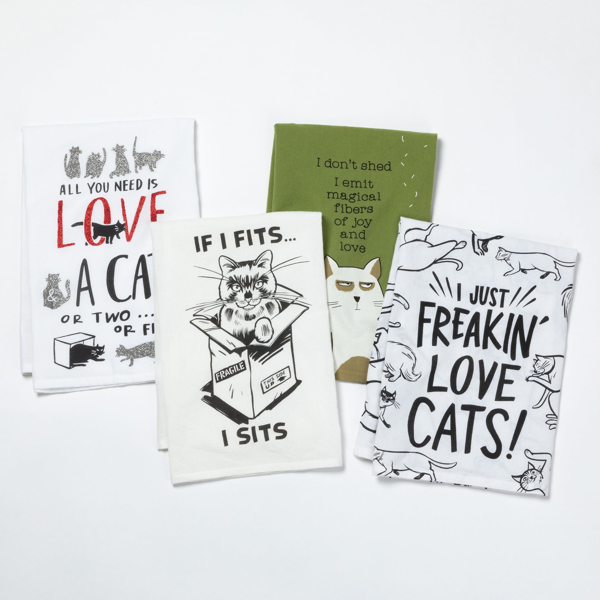 Set of four cat-themed kitchen towels with various sayings on a white background