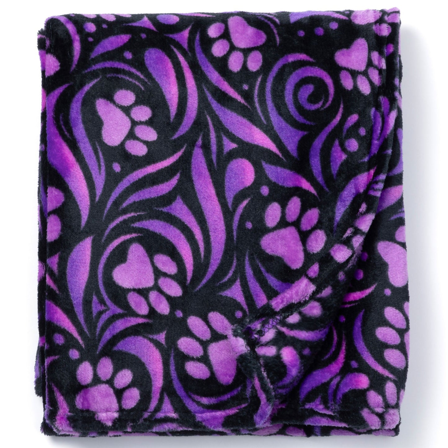 Folded purple and black patterned blanket on a white background