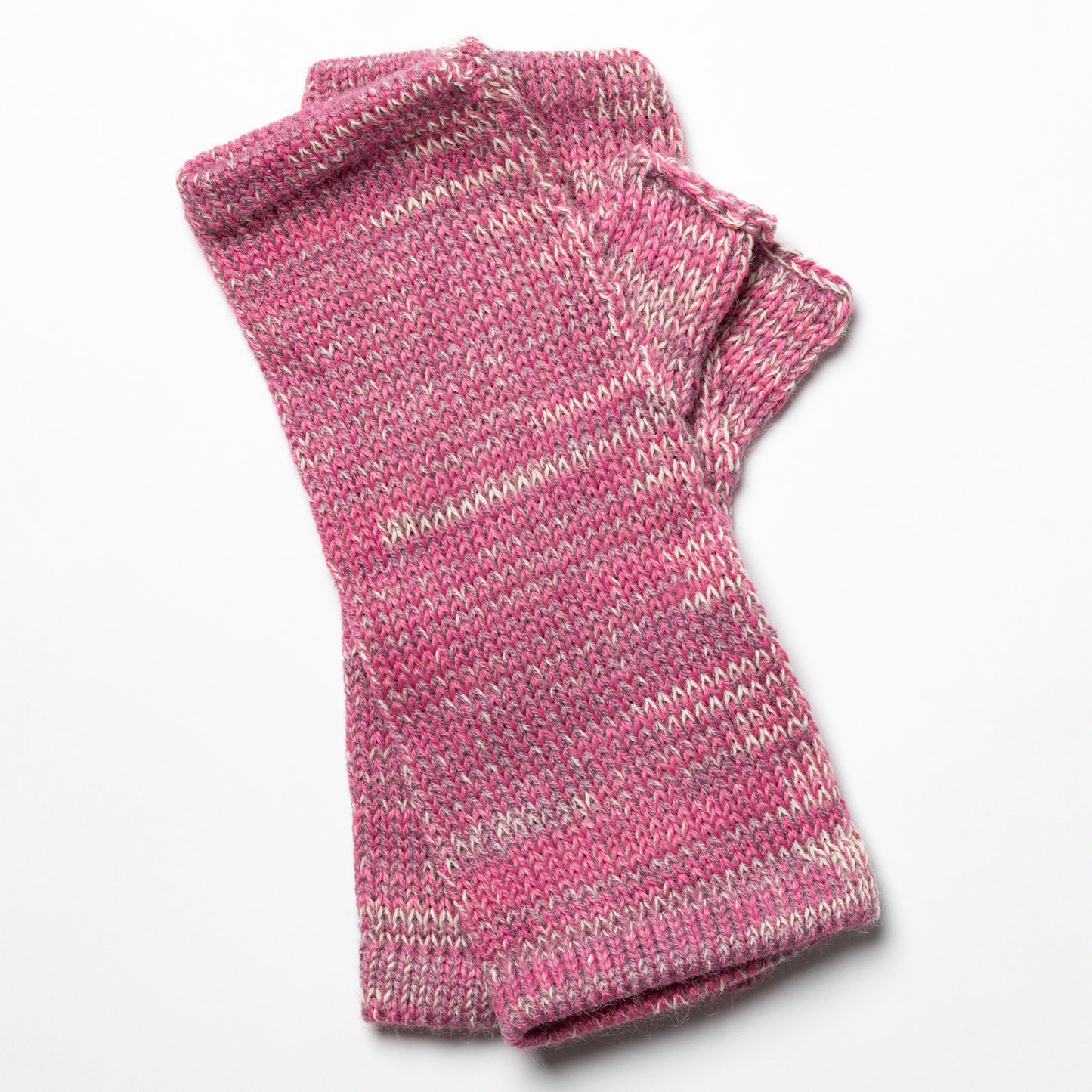 Pink knitted fingerless gloves on a white background