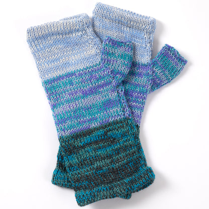 a pair of alpaca fingerless mittens in shades of blue made from alpaca wool on a white background