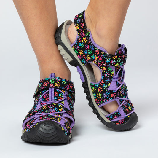 Close-up of colorful sandals featuring floral patterns, perfect for outdoor activities.