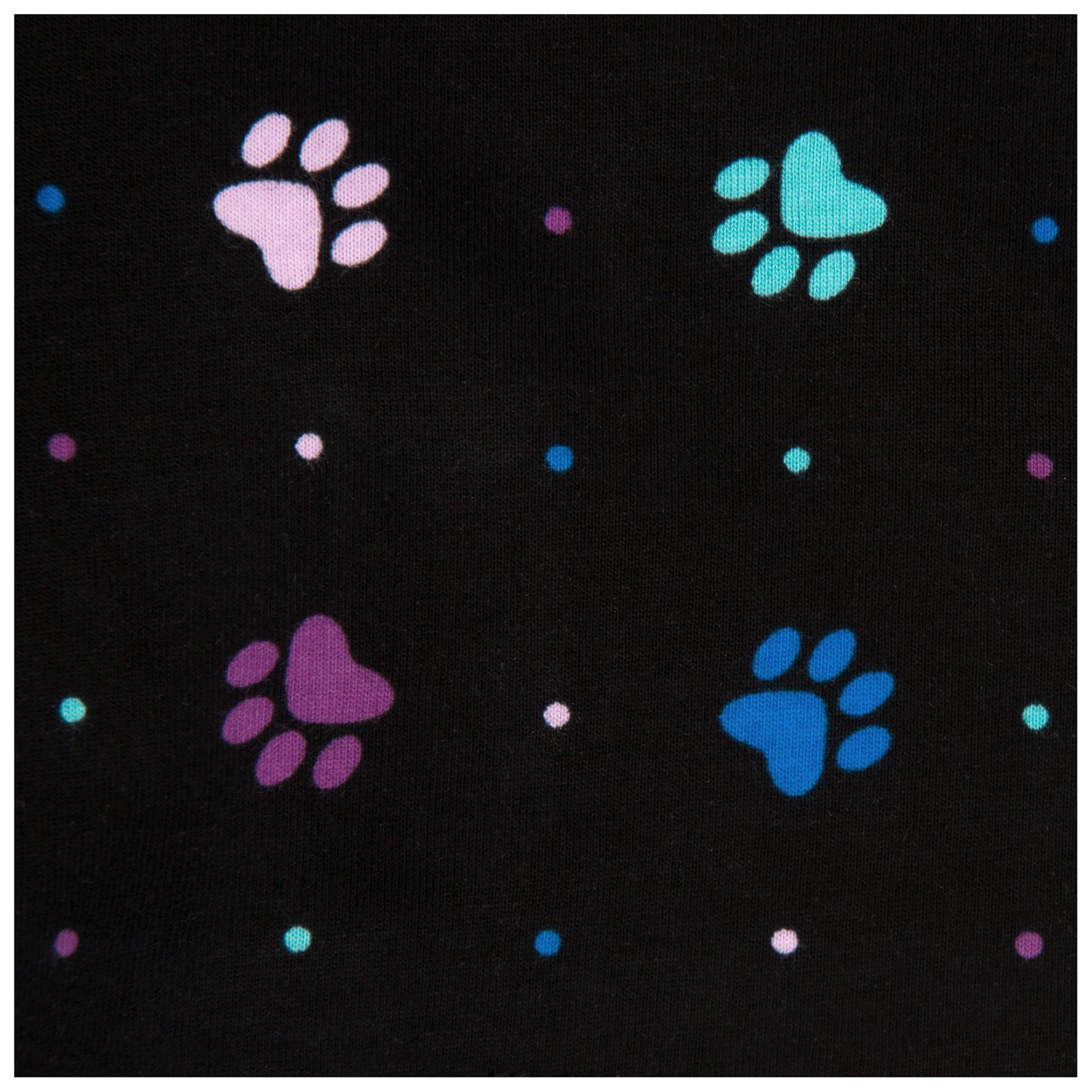 close up image of Black fabric of shorts with colorful paw prints and polka dots