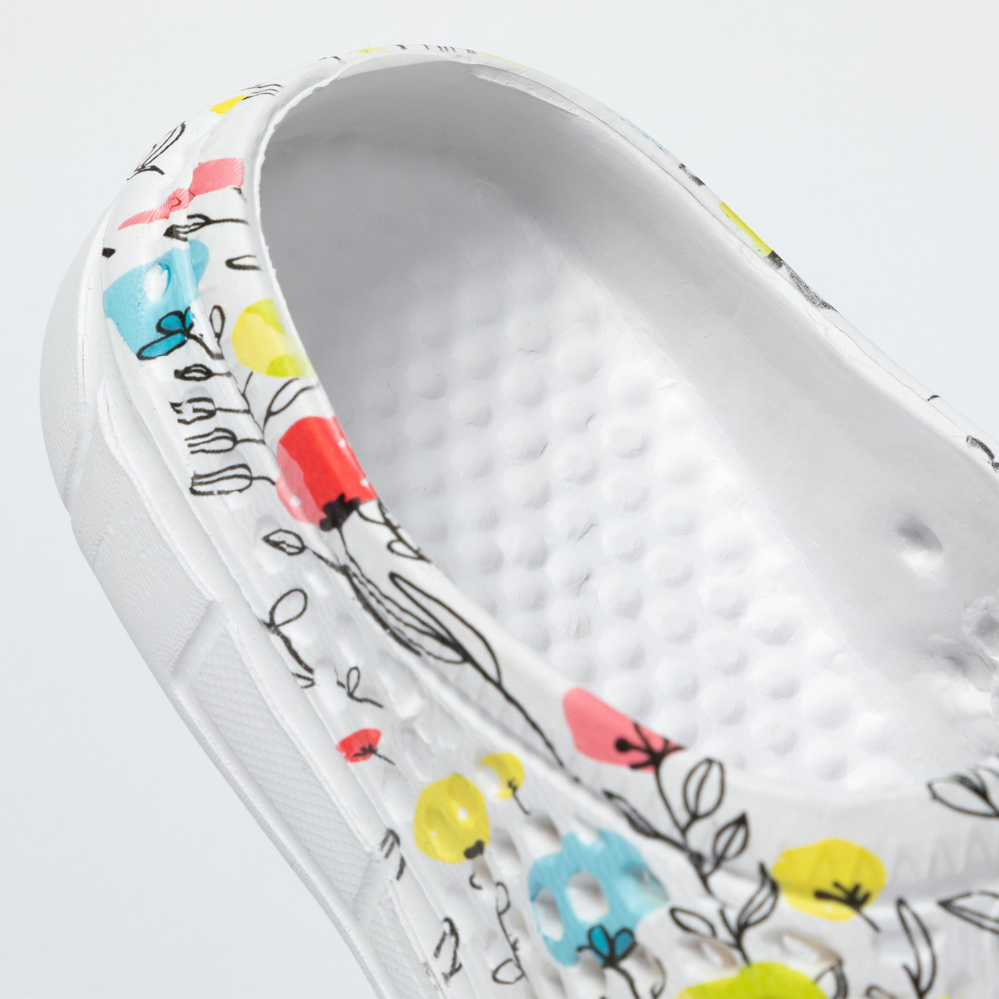 Insole of clog with a floral design on a white background