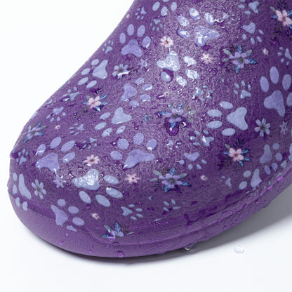 Purple clog with floral and paw print pattern with water droplets, on a white background