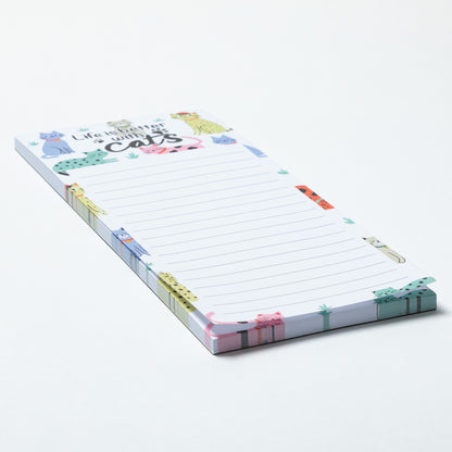 Notepad with cat illustrations and text on a white background