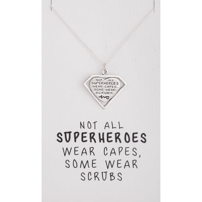 Necklace with a heart-shaped pendant on a white card with text.