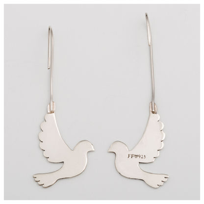 Back of silver dove-shaped earrings on a light gray background