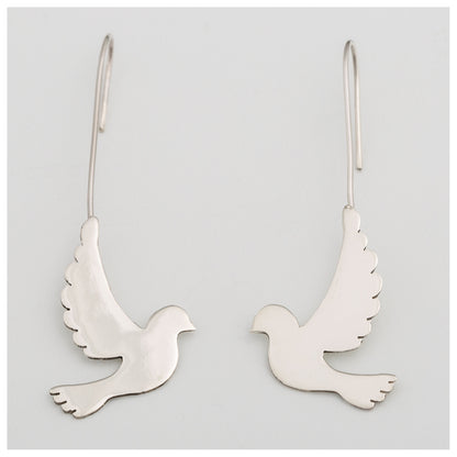 Silver dove-shaped earrings on a light gray background