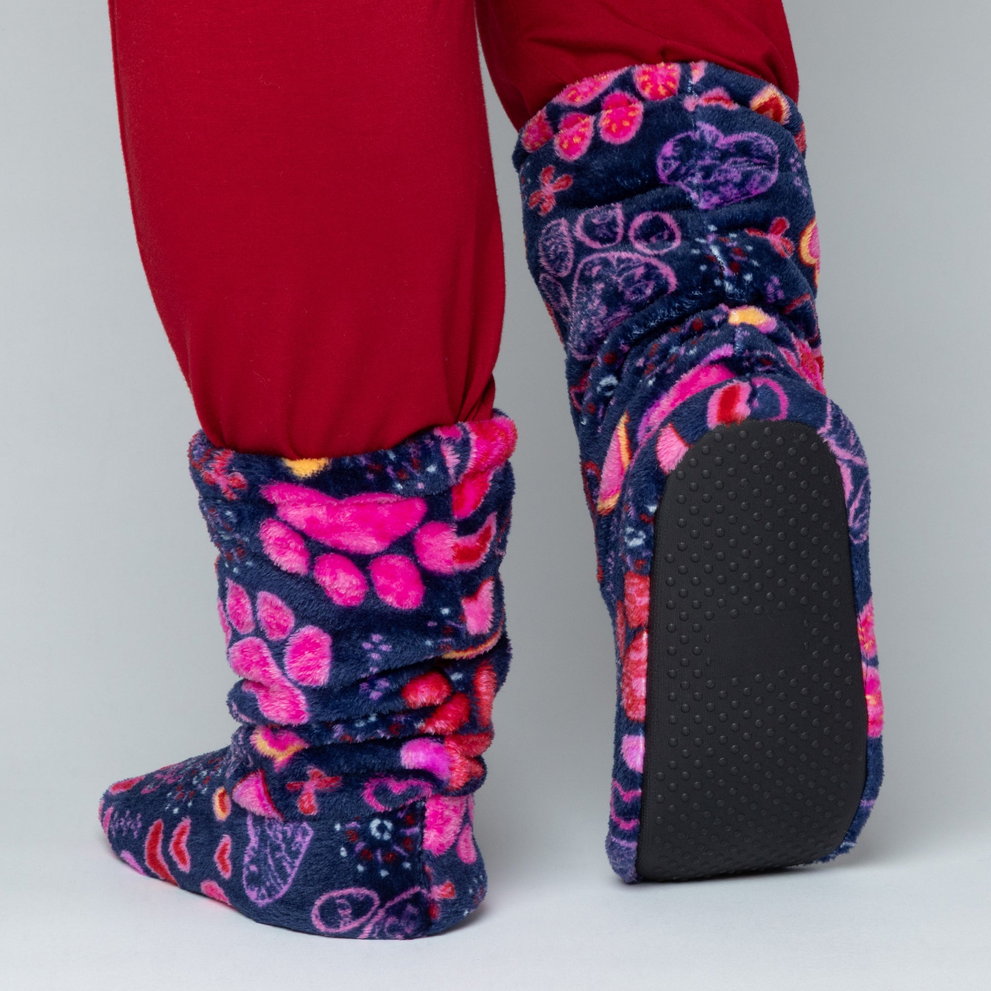 Patterned slipper boots with a textured sole on a neutral background.