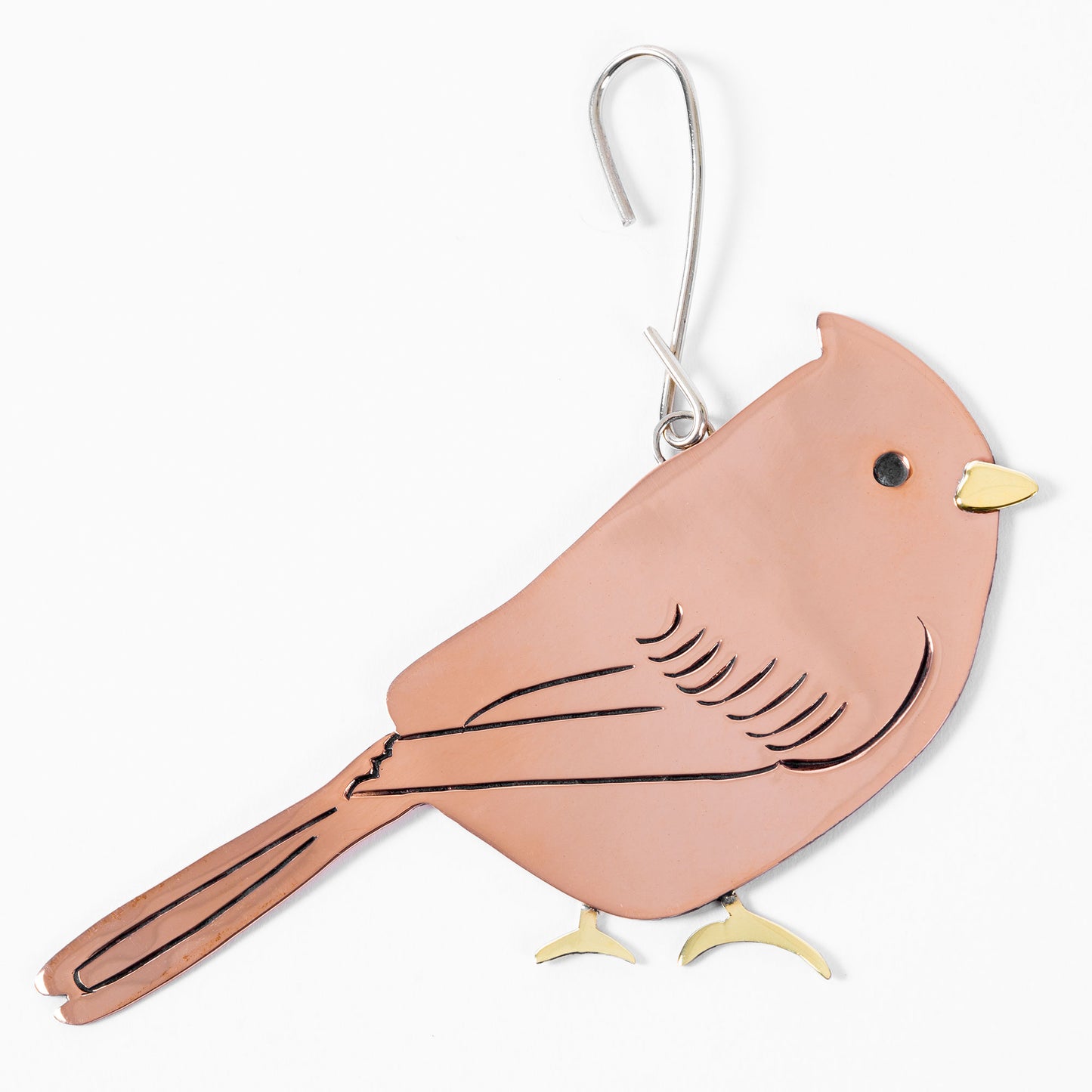 Copper-colored bird-shaped ornament on a white background.