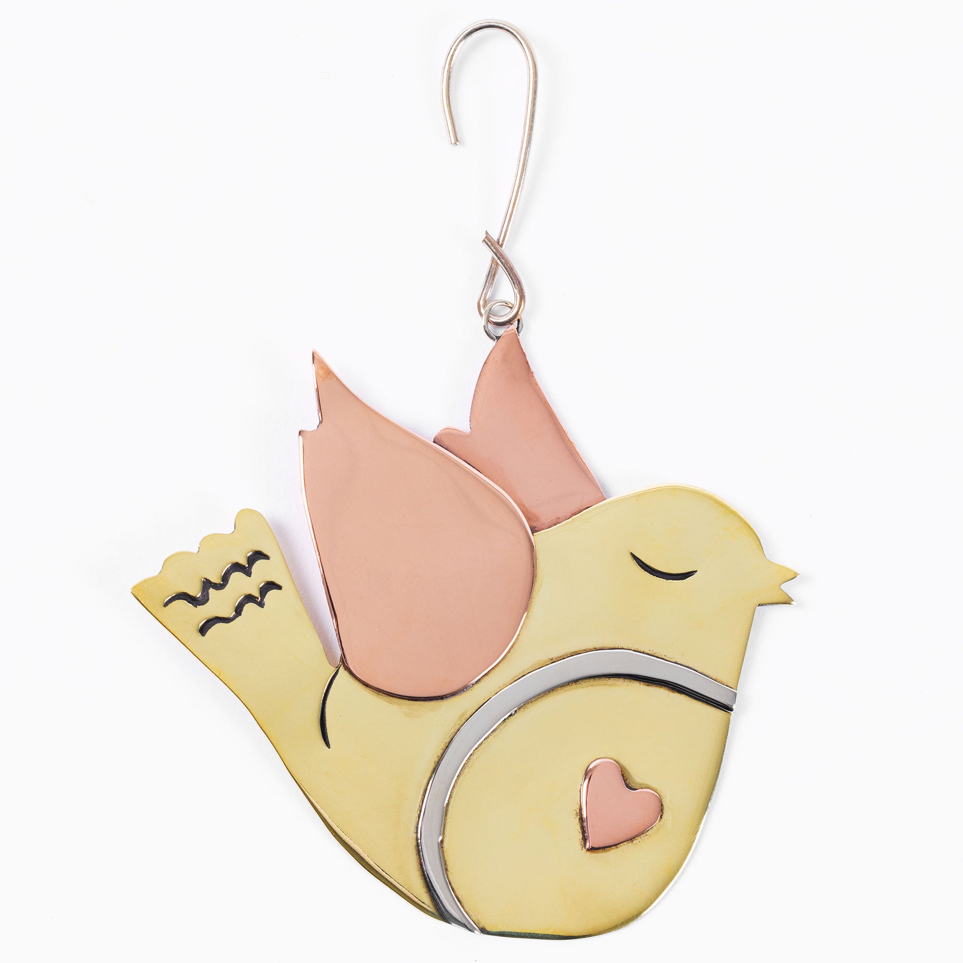 Decorative brass bird ornament with copper heart on a white background.