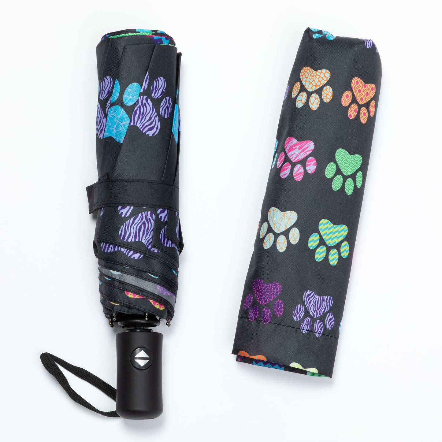 Black umbrella with colorful paw print pattern on a white background