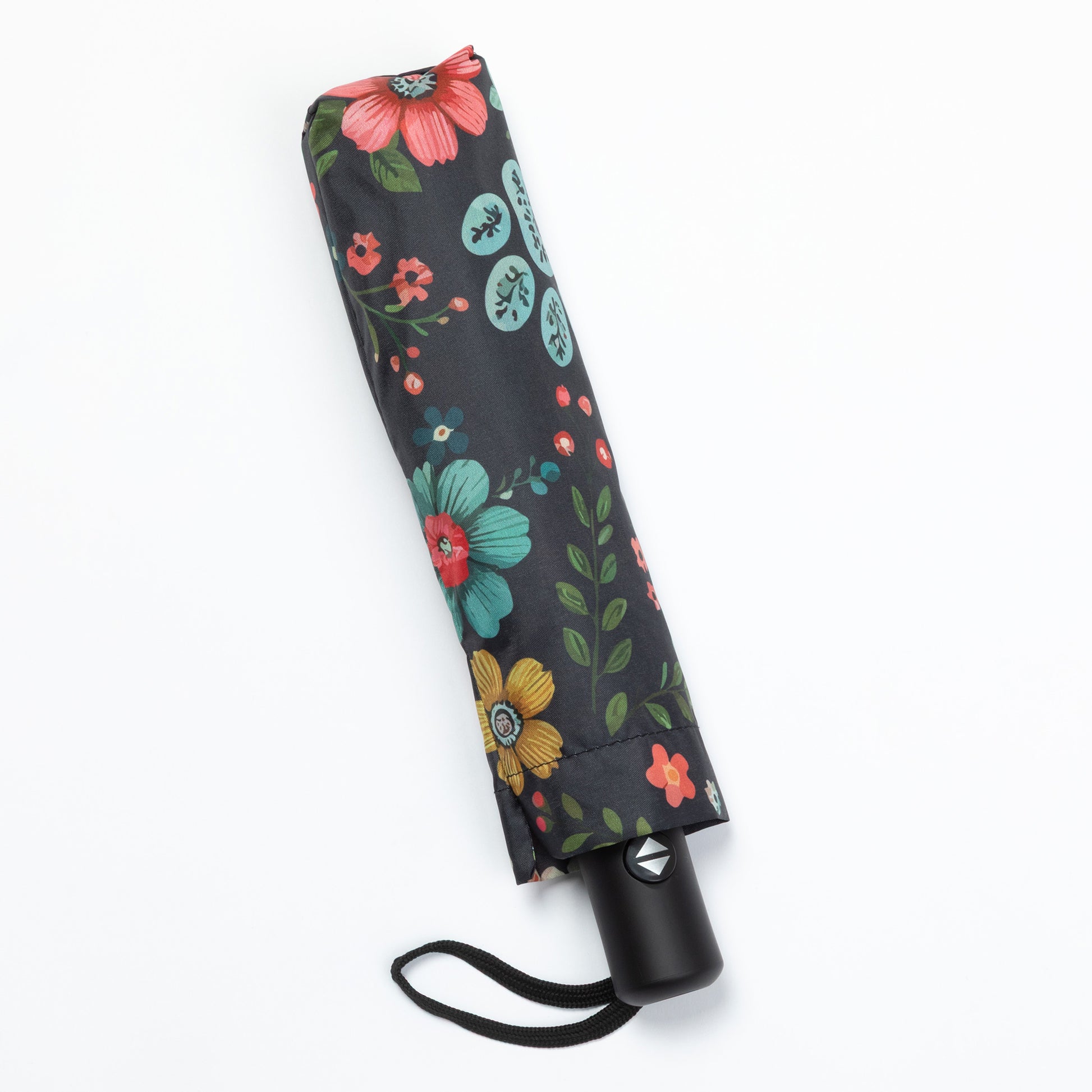 Foldable umbrella with floral and paw print pattern on a white background