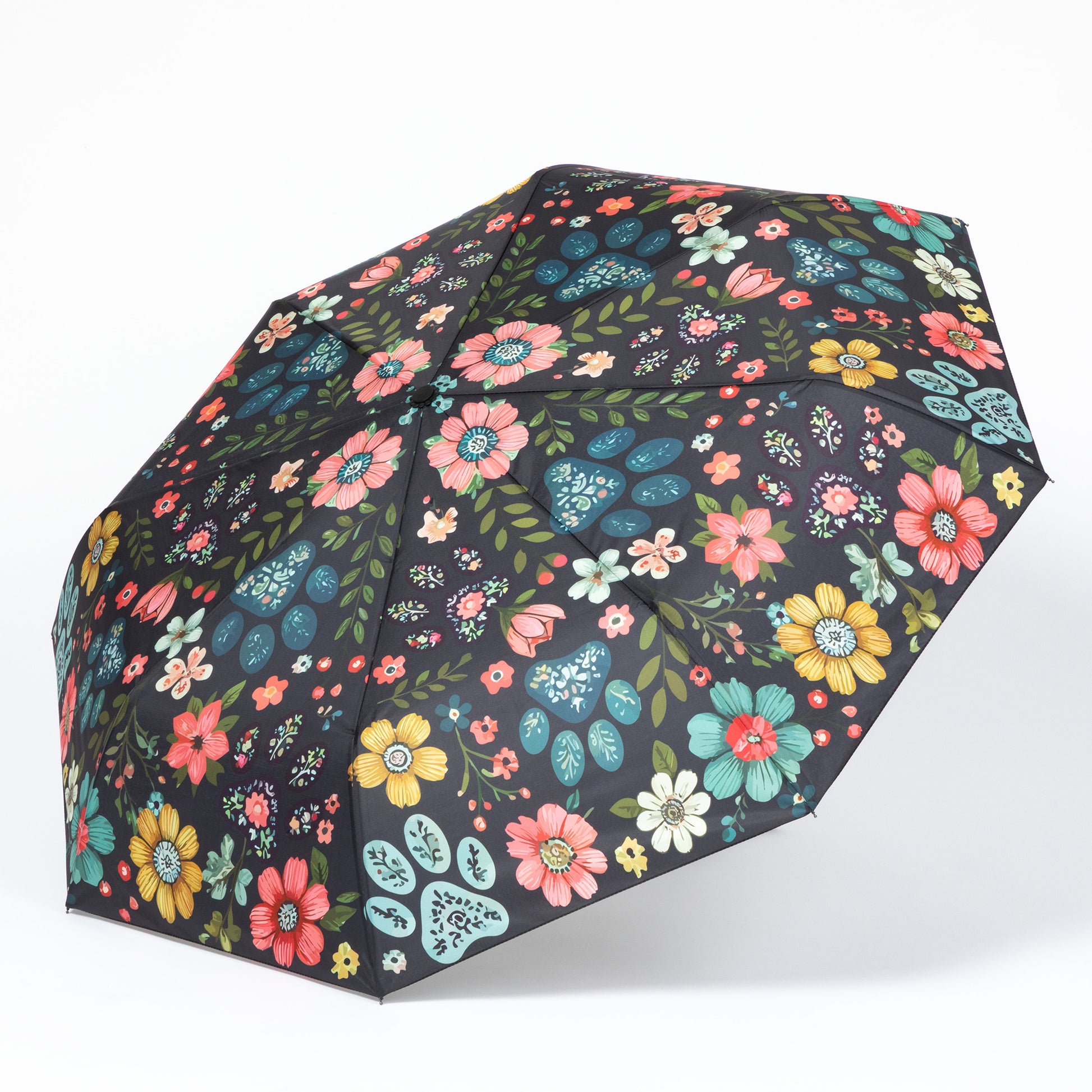 Floral-patterned paw print umbrella on a white background