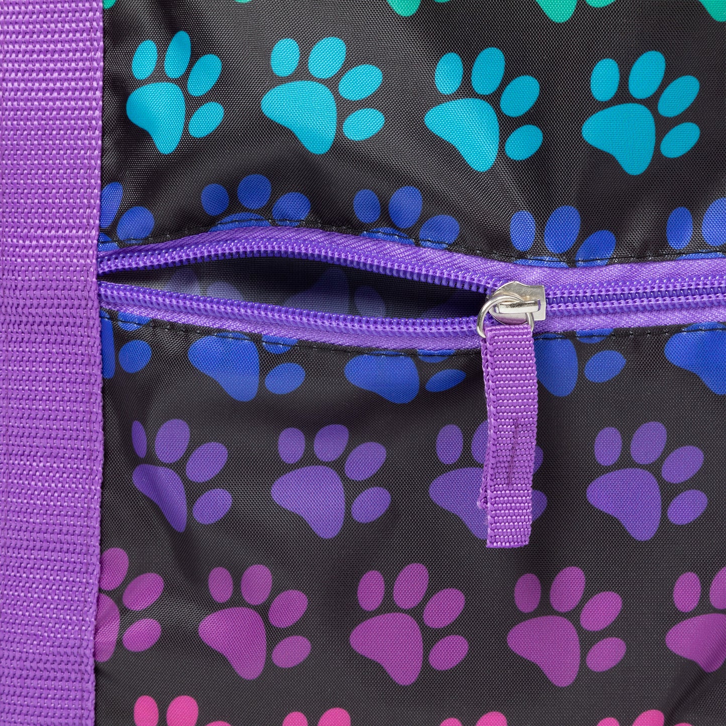 Duffel bag with purple and blue paw print pattern on a black background