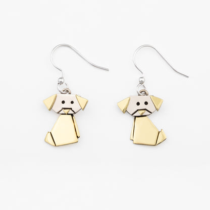 Dog-shaped origami style earrings on a white background