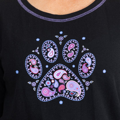 Purple paisley paw print design on the front of a black thermal crew neck long sleeve tee.