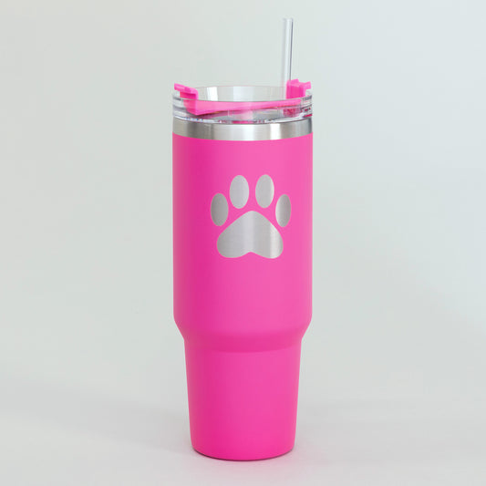Pink stainless steel tumbler with a paw print on the front, on a white background.