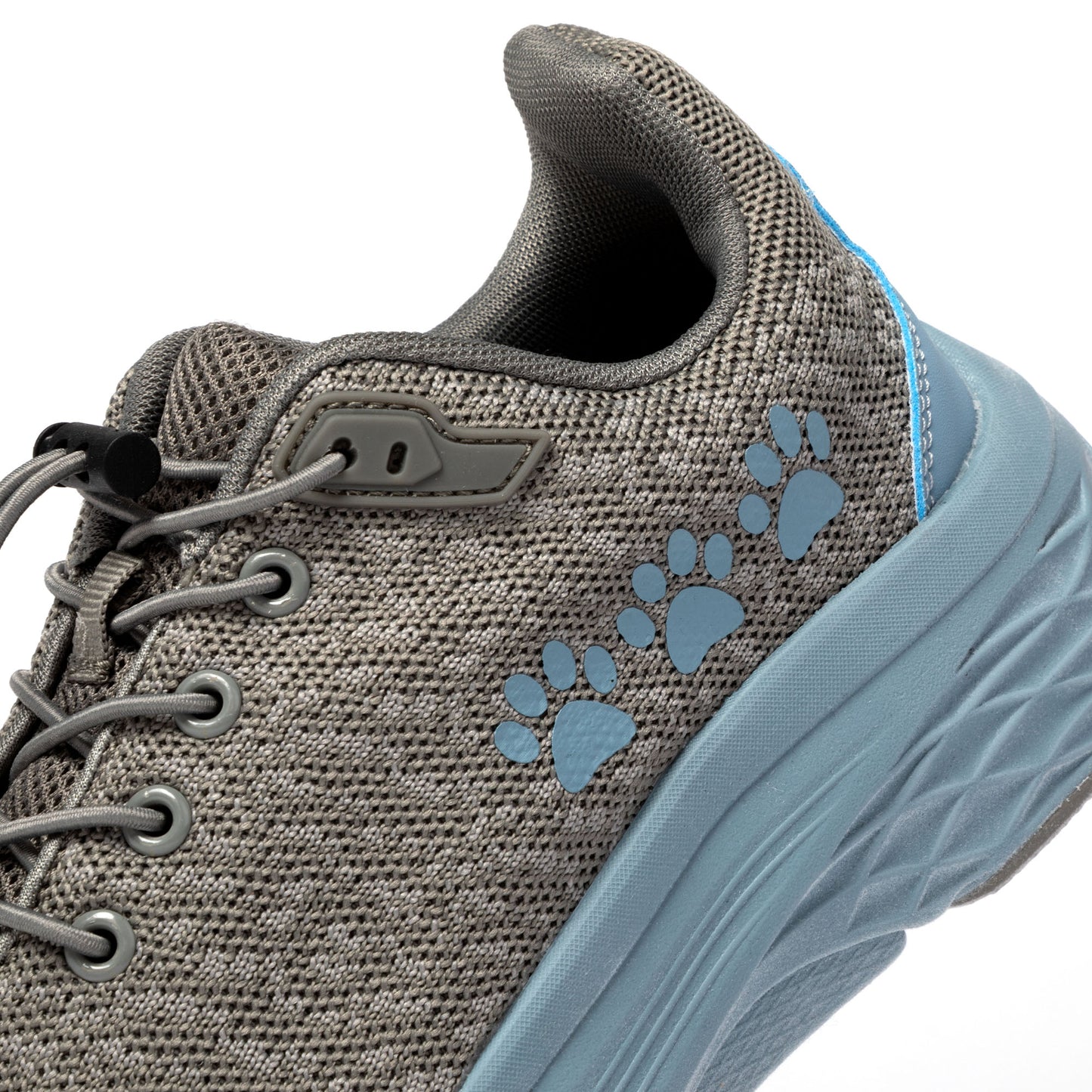 Gray sneaker with blue paw prints on a white background.