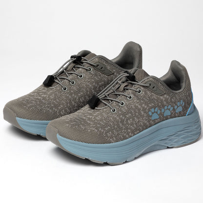Gray running shoes with blue soles and three blue paw prints on the side, on a white background