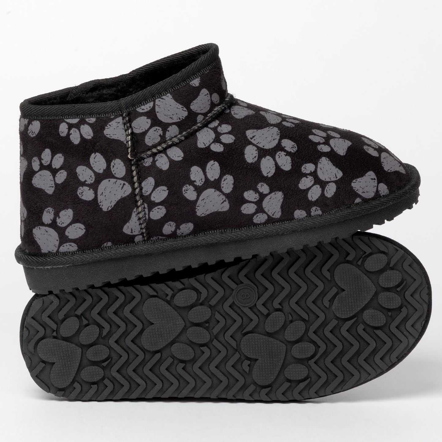 Black slip-on shoes with paw print pattern on a white background