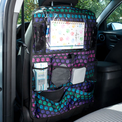 Car seat organizer with paw print pattern hanging on a car seat
