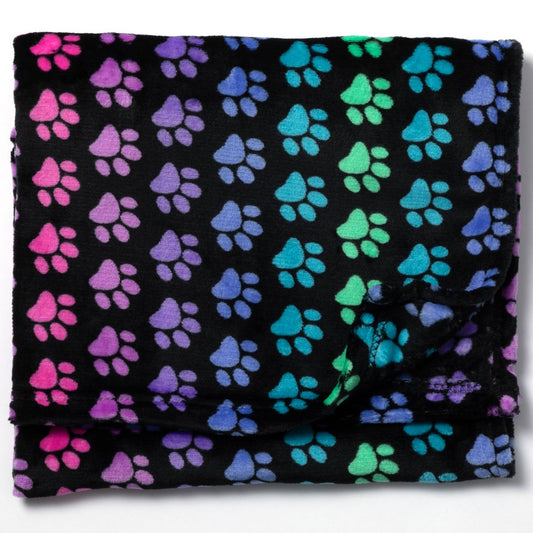 Folded black fleece blanket with rainbow color paw prints on a white background.