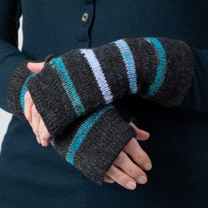 Black fingerless gloves with blue stripes worn by a person against a dark background