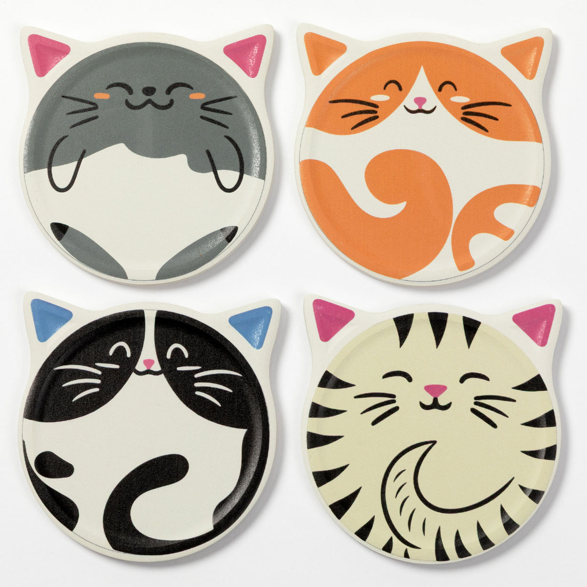 Four coasters featuring cartoon cat faces in different colorways: gray and white, orange and white, black and white, and cream and black with pink ears and nose. The coasters are arranged in a 2x2 grid on a plain white background.