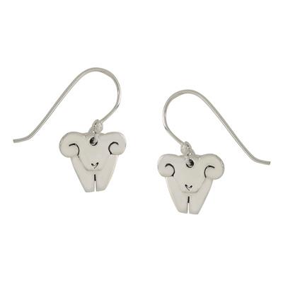Silver tone earrings with dangling rams, on a white background.