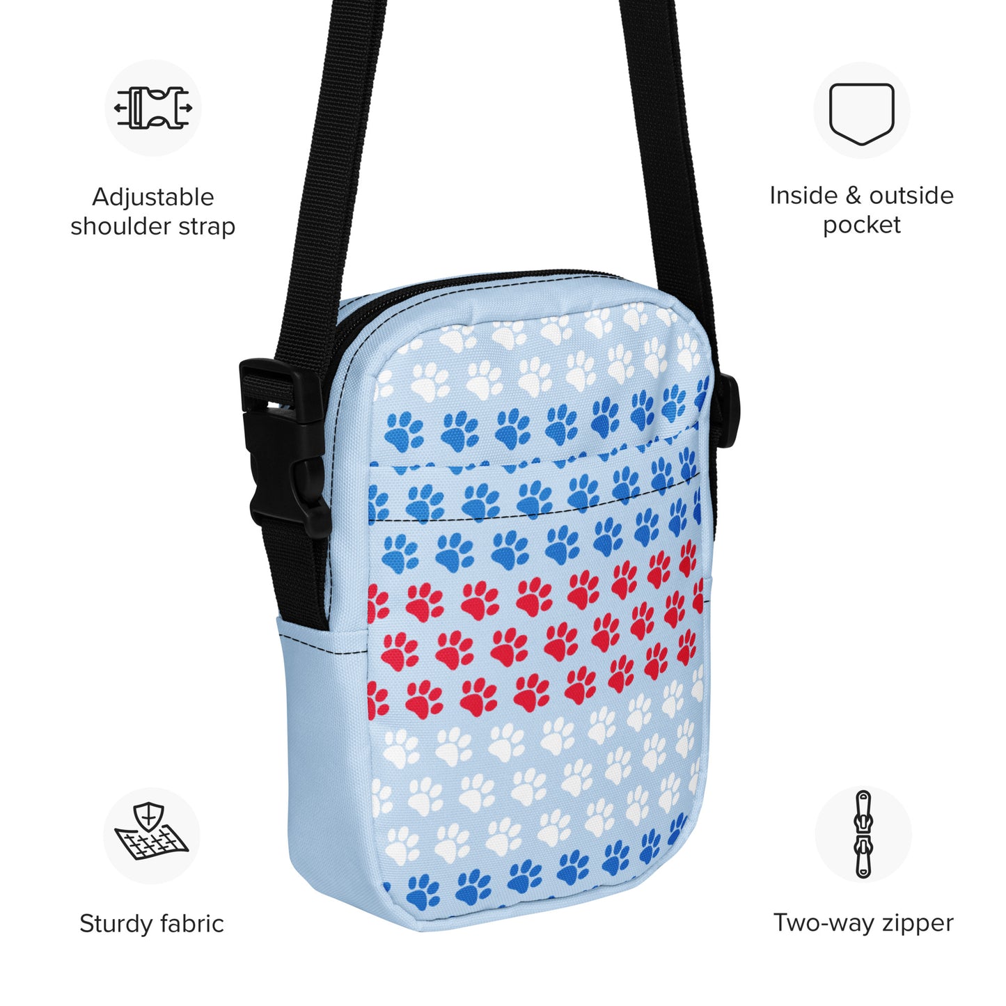 Small crossbody bag with paw print pattern on a white background